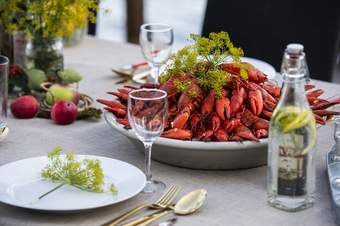 A photograph showing a plate piled high with pink crayfish as part of the Swedish Kraftskiva festival.