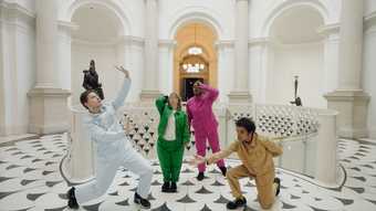 The four dancers in different poses by the Tate Britain spiral stairs